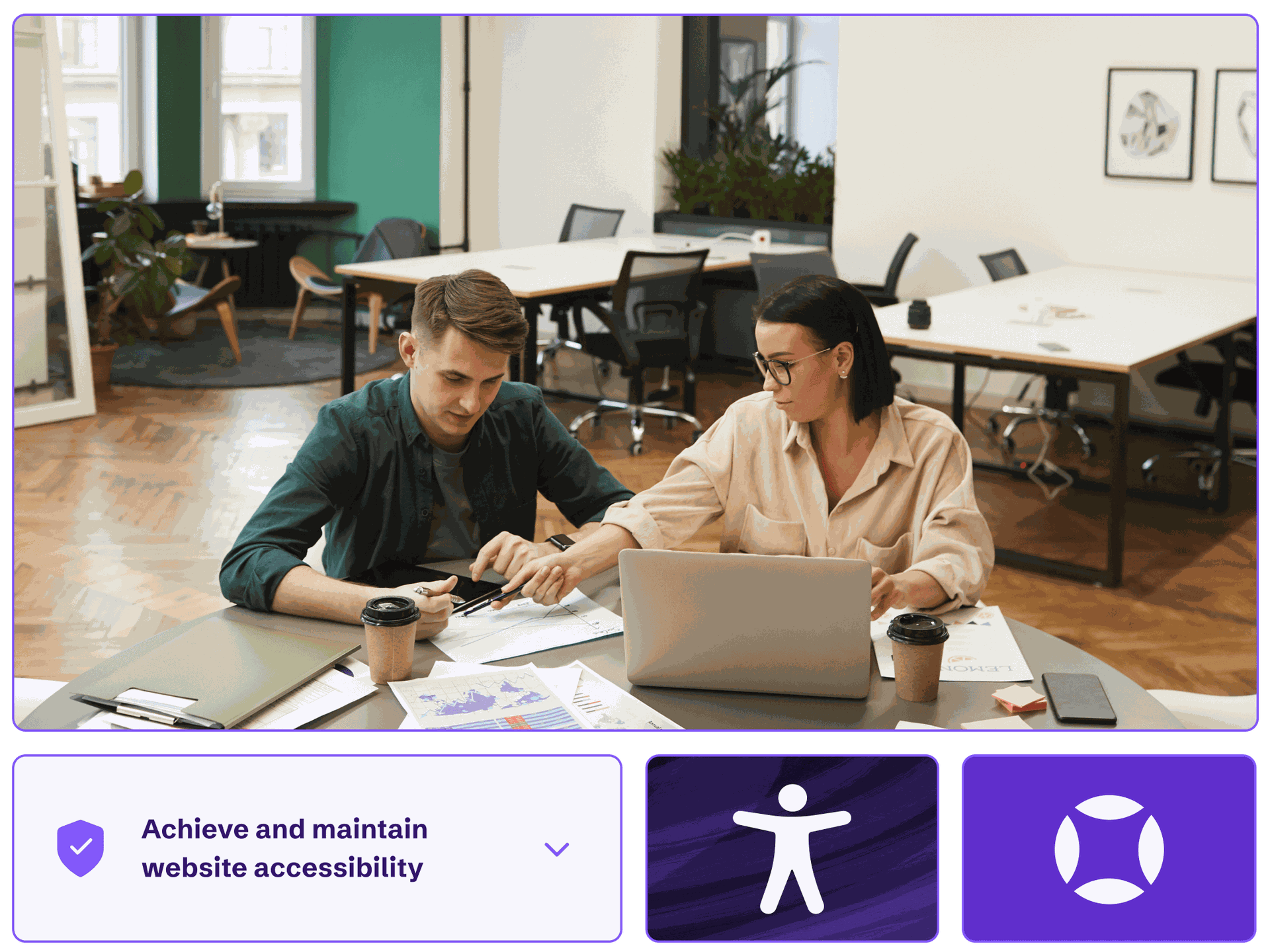 Two colleagues working at a computer helping customers achieve and maintain website accessibility.