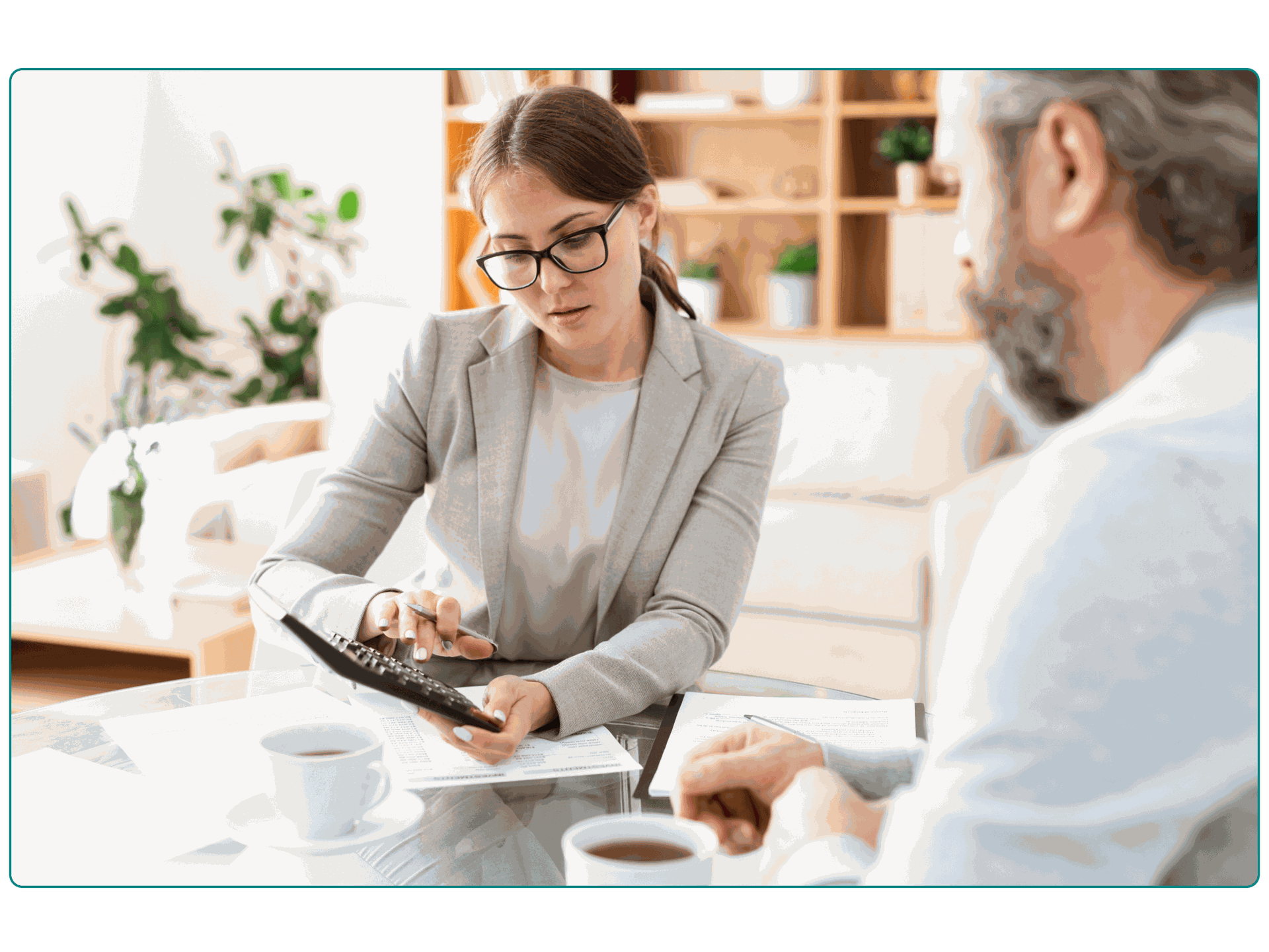 A woman calculating increased revenue with her colleague.