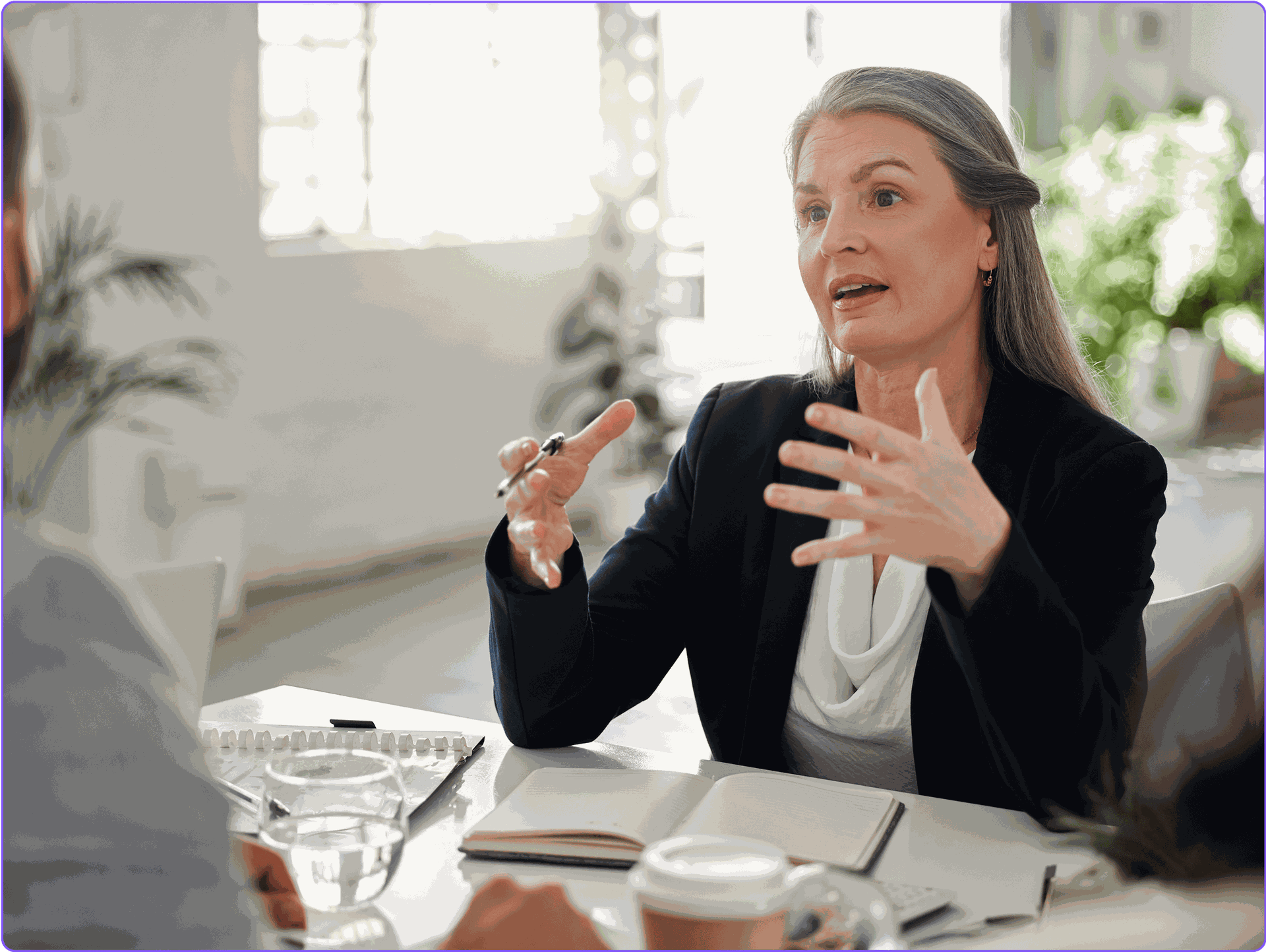 A female lawyer meeting with her clients.