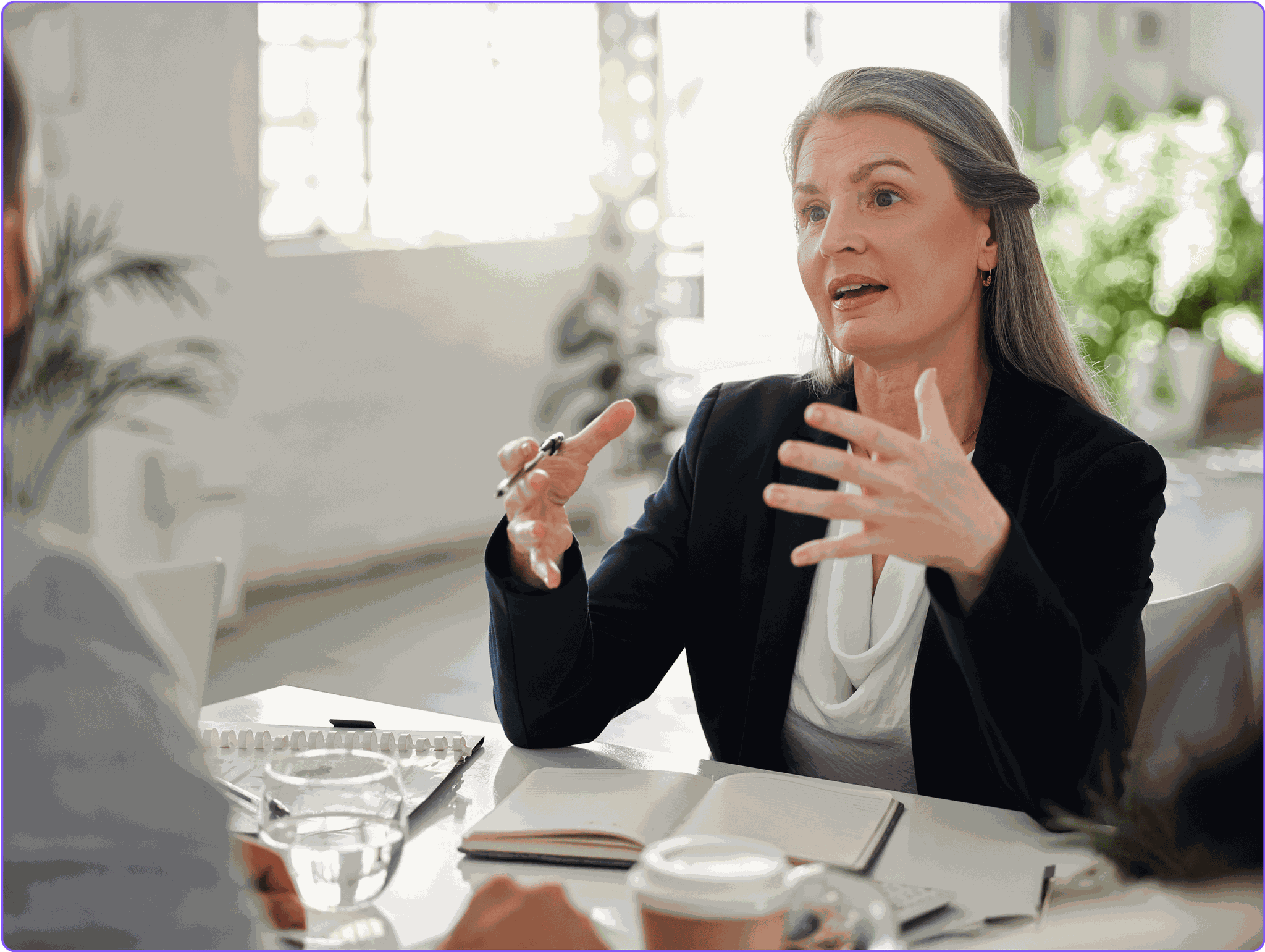A female lawyer meeting with her clients.