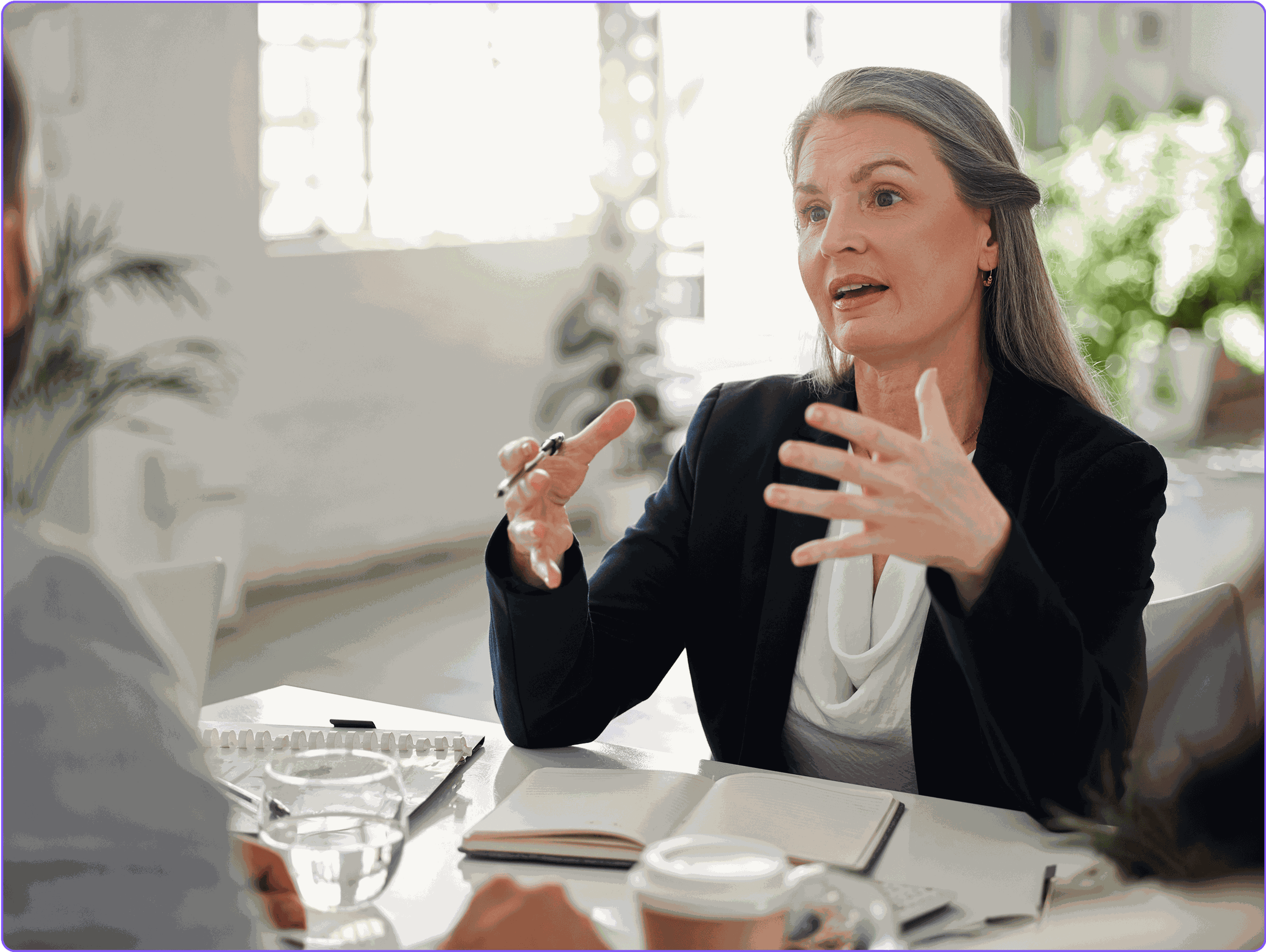 A female lawyer meeting with her clients.