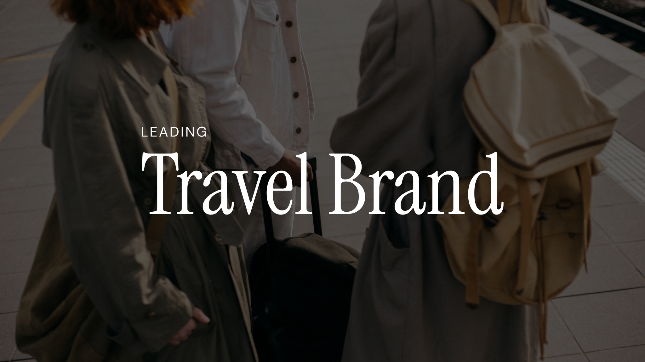 Three people with luggage at a station platform, overlaid with the text "Leading Travel Brand."