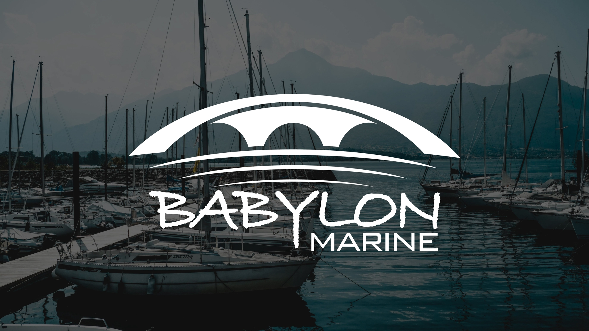 Logo of "Babylon Marine" over a marina with docked sailboats