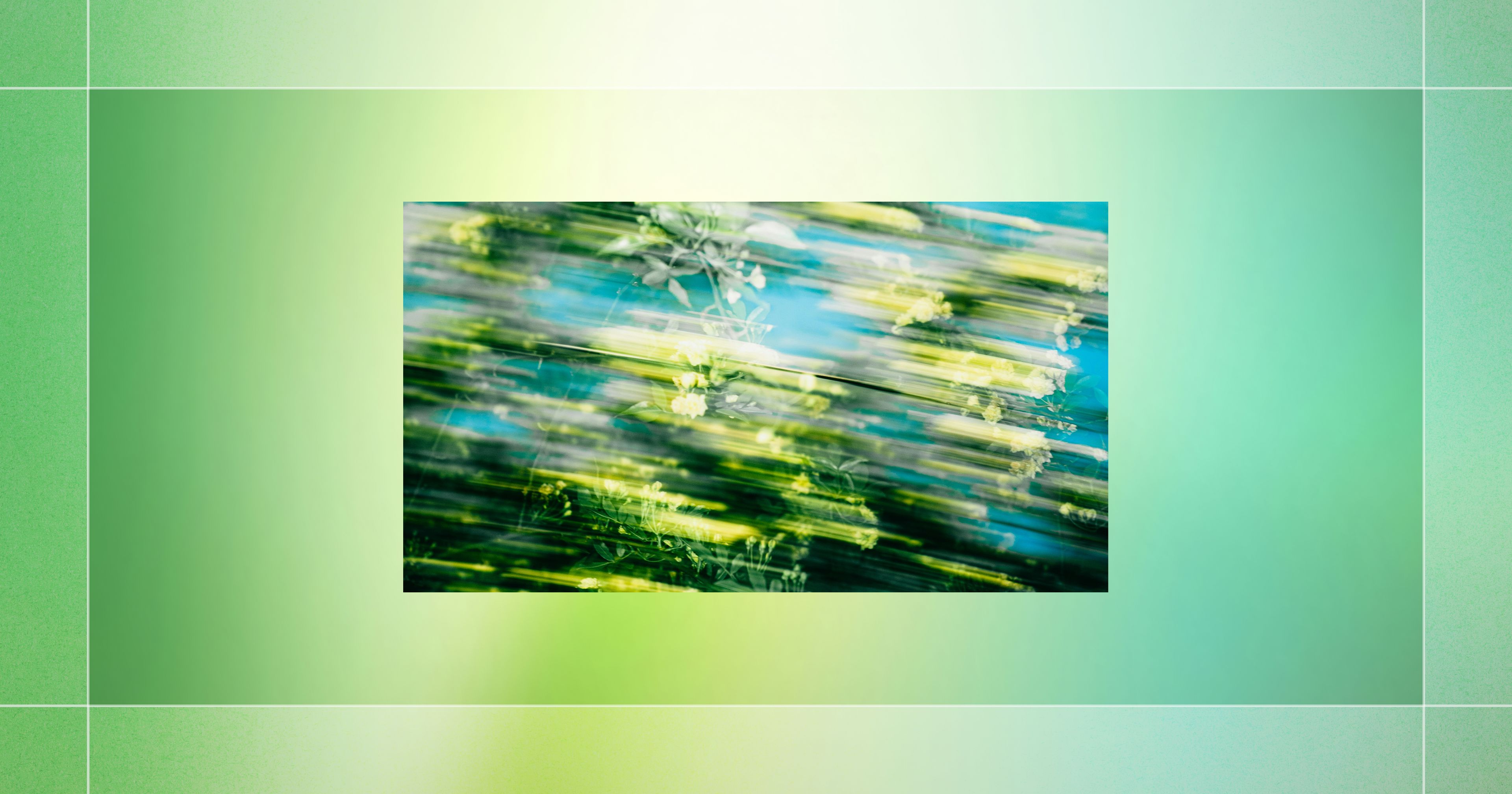 Abstract green and yellow streaks blur over a gradient blue and green background, creating a dynamic impression of motion.