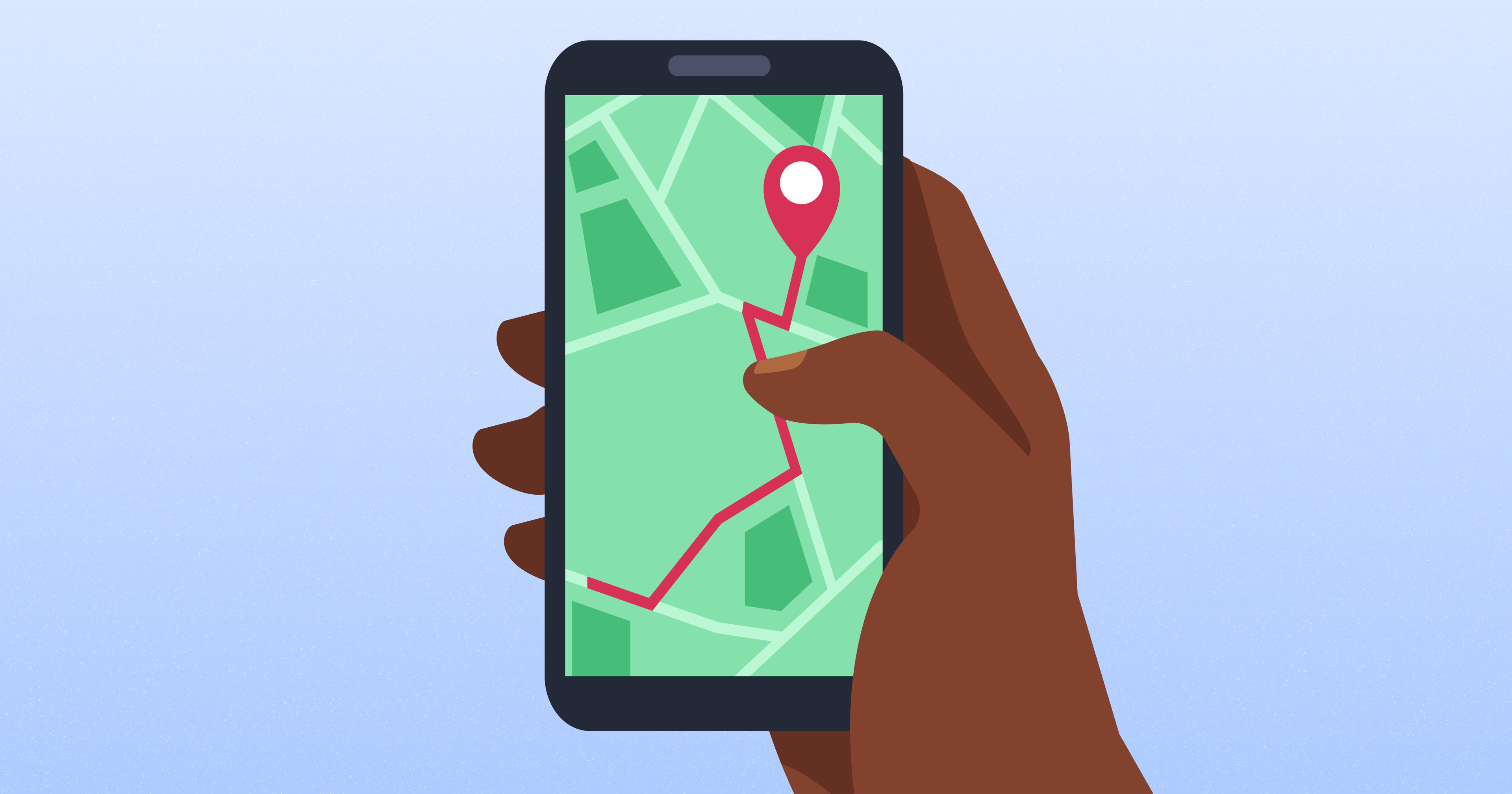 A hand holding a smartphone displaying a map with a red route line and a destination pin.