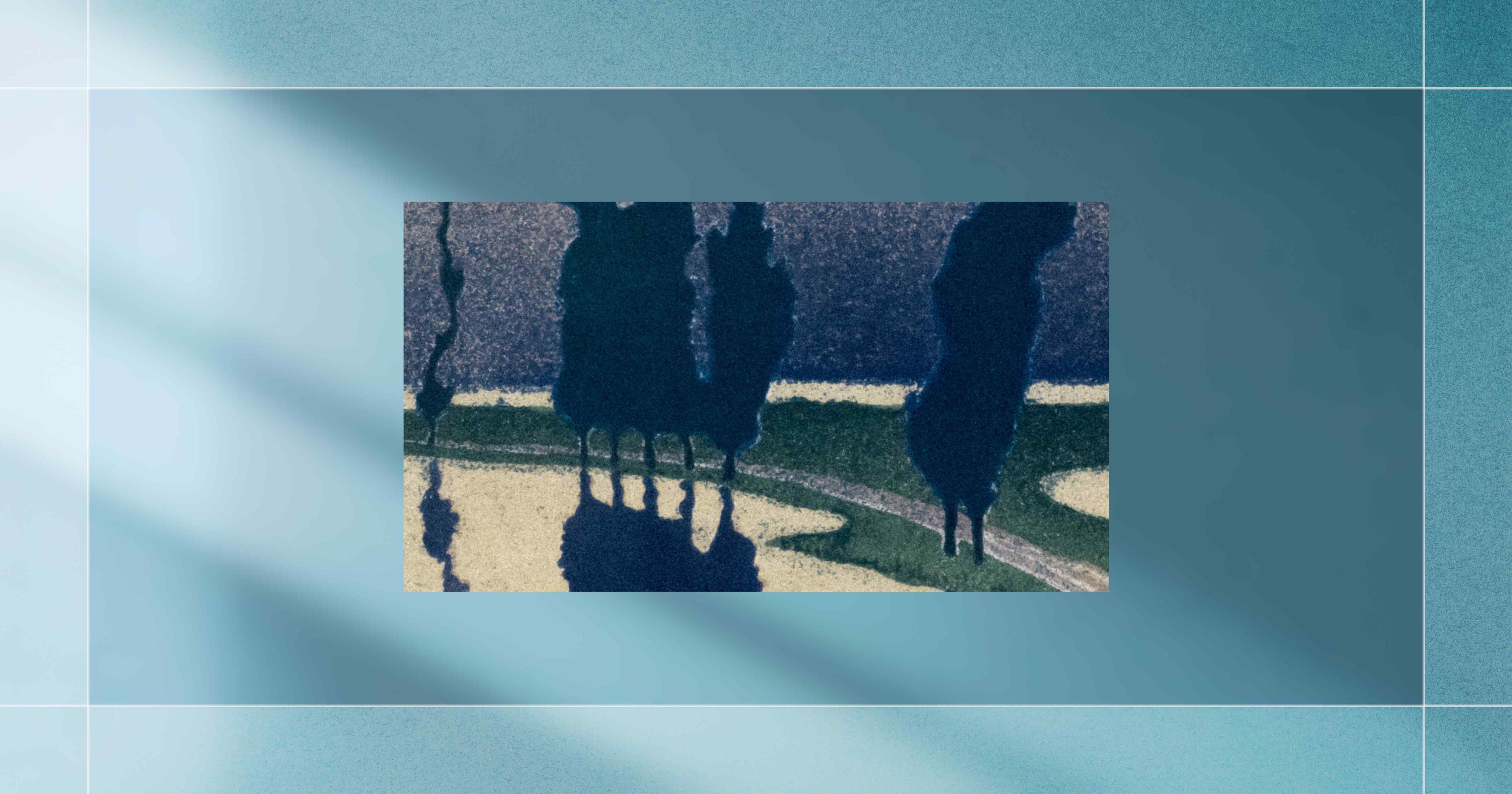 Artistic depiction of trees casting shadows on a multi-colored landscape with blue, green, and yellow tones, framed by a blue-gray border.