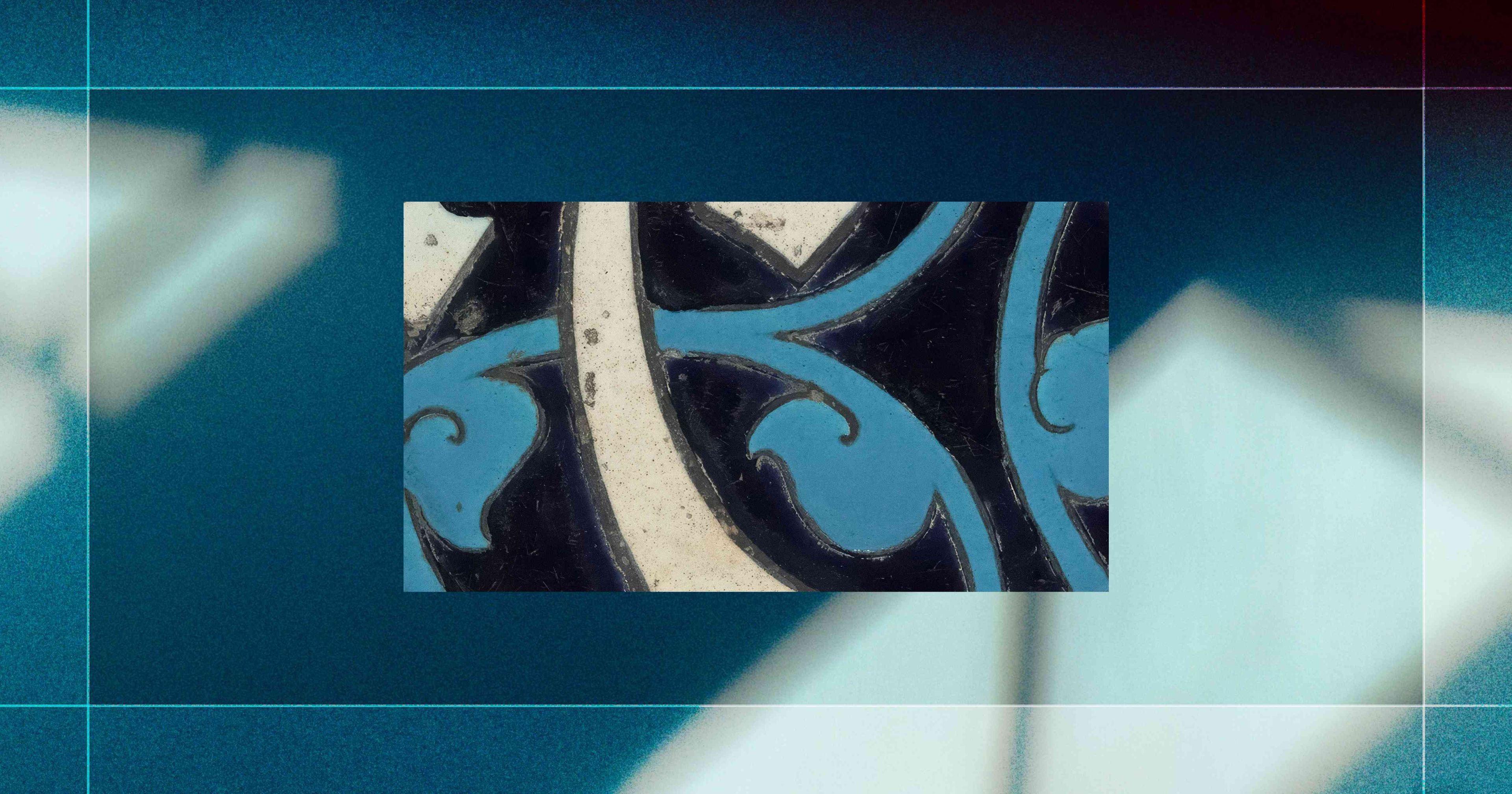 Abstract art with blue, black, and white swirling patterns centered on a blurred blue-green background with white geometric shapes.